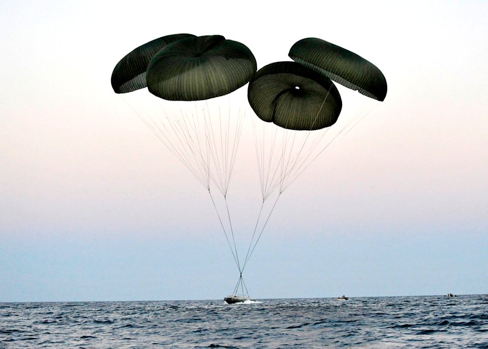 US Navy 100608-N-8689C-063 A Naval Special Warfare 11-meter rigid-hull inflatable boat parachutes near Ft. Walton Beach during a maritime craft aerial deployment system exercise