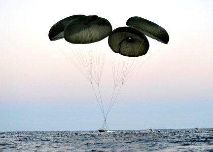 US Navy 100608-N-8689C-063 A Naval Special Warfare 11-meter rigid-hull inflatable boat parachutes near Ft. Walton Beach during a maritime craft aerial deployment system exercise