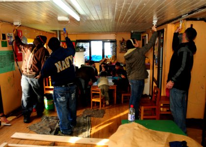 US Navy 100608-N-9301W-151 Sailors assigned to the guided-missile frigate USS Klakring (FFG 42) paint the ceiling of a preschool during a community service project in Puerto Montt, Chile