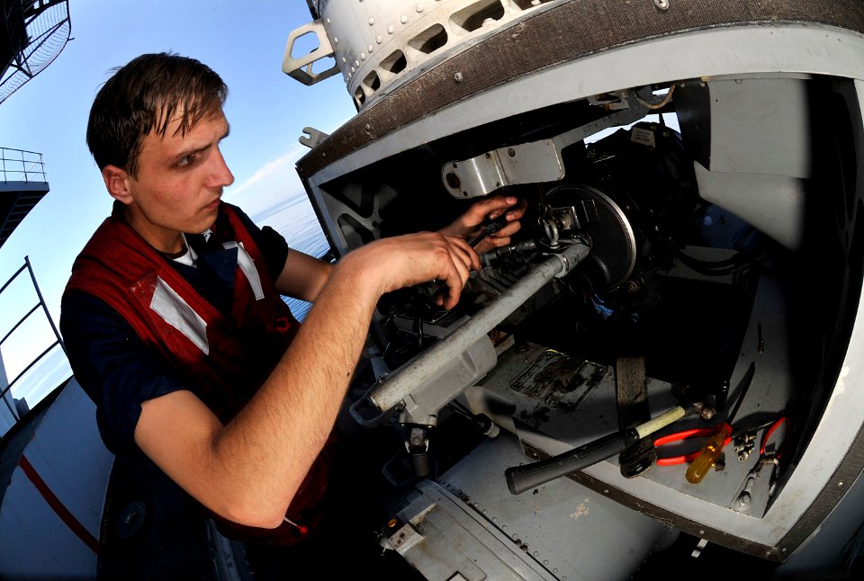 US Navy 100606-N-7317W-015 Fire Controlman 2nd Cass Brandon Ruldolph, performs maintenance on the Close-in Weapons System (CIWS) aboard the Nimitz-class aircraft carrier USS Harry S. Truman (CVN 75)