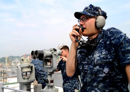 US Navy 100607-N-0120A-013 Operations Specialist Seaman Coty White, assigned to the forward-deployed amphibious assault ship USS Essex (LHD 2), reports surface contacts on a sound powered phone as a part of the special sea and