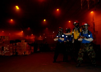 US Navy 100607-N-3620B-023 Sailors prepare to fight a simulated fire during a general quarters drill aboard USS Enterprise (CVN 65).