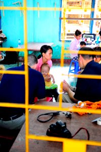 US Navy 100609-N-6410J-041 A Vietnamese woman holds her son at the Hai Cang medical clinic during a medical community service project