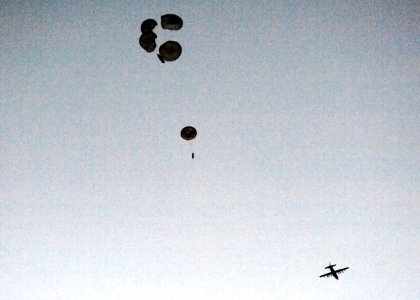 US Navy 100608-N-8689C-007 A Naval Special Warfare 11-meter rigid-hull inflatable boat parachutes near Ft. Walton Beach during a maritime craft aerial deployment system exercise