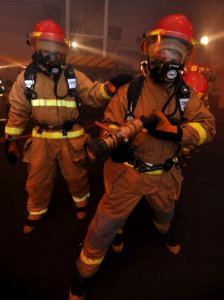 US Navy 100607-N-4516G-053 Sailors fight a simulated fire during a general quarters drill aboard USS Enterprise (CVN 65)
