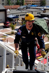 US Navy 100609-N-7730P-026 John Burgess climbs a Tele-Squirt 65 to access the top floor of a simulated collapsed building during the first day of Exercise Reliant Star