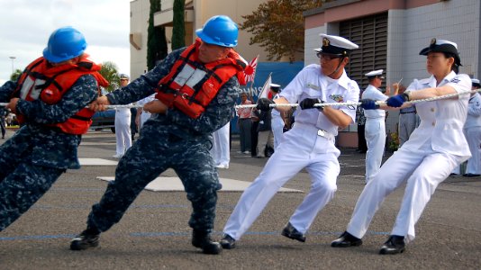 US Navy 100608-N-7498L-163 Seaman Colton Sears and Operations Specialist 2nd Class Aaron Boyer work alongside Petty Officer 3rd Class M. Ueno and Leading Seaman Kaho Nishimura
