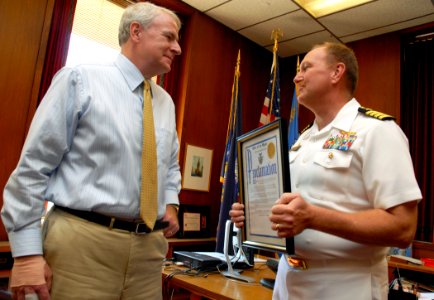 US Navy 100610-N-5208T-001 Capt. William R. Radomski, commanding officer of the Marquette University Navy ROTC accepts a proclamation from Milwaukee Mayor Tom Barrett declaring this week Milwaukee Navy Week