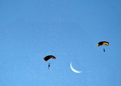 US Navy 100608-N-8689C-130 Navy SEALs and special warfare combatant-craft crewmen parachute during a maritime craft aerial deployment system exercise off the coast of Fort Walton Beach Florida photo