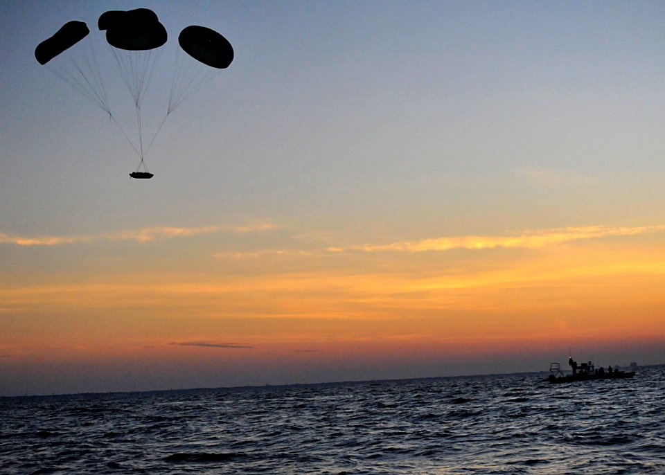 US Navy 100608-N-8689C-051 A Naval Special Warfare 11-meter rigid-hull inflatable boat parachutes near Ft. Walton Beach during a maritime craft aerial deployment system exercise