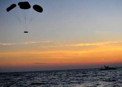 US Navy 100608-N-8689C-051 A Naval Special Warfare 11-meter rigid-hull inflatable boat parachutes near Ft. Walton Beach during a maritime craft aerial deployment system exercise
