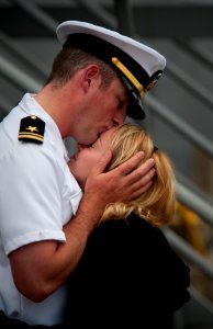 US Navy 100610-N-5319A-090 Lt. j.g. Mark Belanger says goodbye to a loved one before boarding USS New Orleans (LPD 18) for a scheduled three-month deployment
