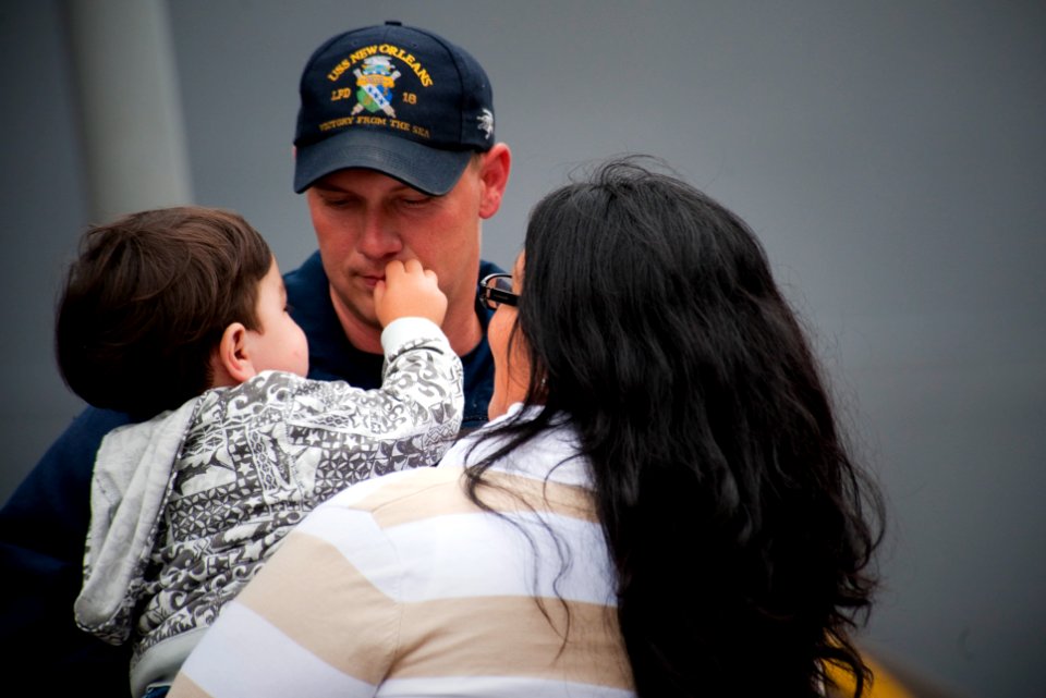 US Navy 100610-N-5319A-077 Boatswain's Mate 3rd Class Lewis Palmer says goodbye to his family before boarding USS New Orleans (LPD 18) for a scheduled three-month deployment
