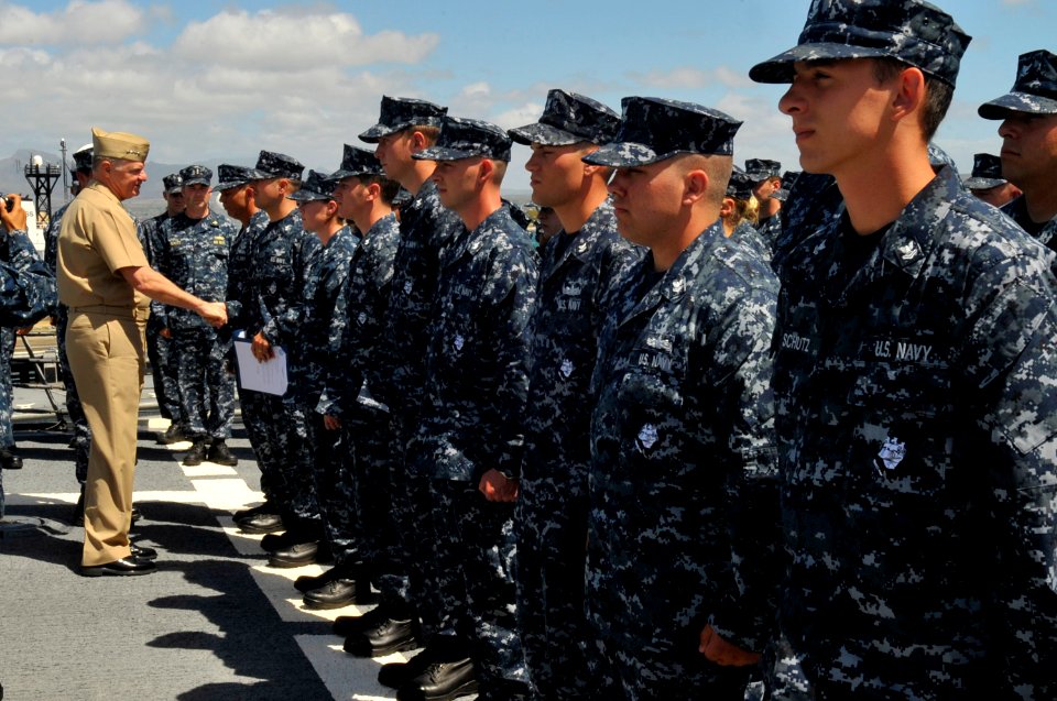 US Navy 100609-N-8273J-037 Chief of Naval Operations (CNO) Adm. Gary Roughead congratulates newly-frocked petty officers before an all-hands call aboard the Arleigh Burke-class Destroyer USS Hopper (DDG 70) at Joint Base Pearl