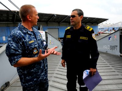 US Navy 100608-N-9643W-349 Capt. Kurt Hedberg, mission commander of Southern Partnership Station 2010, speaks with Commandant Jaimie Delgado, from the Nicaragua Volunteer Firefighters, during a tour of High Speed Vessel Swift (