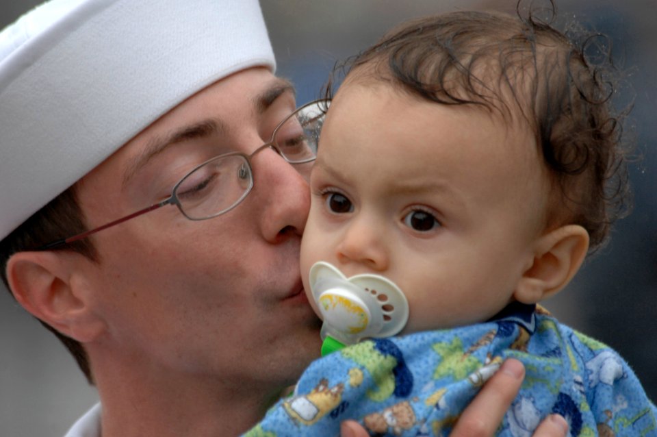US Navy 100610-N-6477M-200 Hospital Corpsman 3rd Class Lee McGraw, assigned to the amphibious transport dock ship USS New Orleans (LPD 18), says good-by to his son before departing from Naval Station San Diego