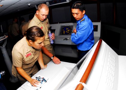 US Navy 100609-N-0995C-019 U.S. and Royal Malaysian Navy Sailors train on a bridge team simulator during Cooperation Afloat Readiness and Training (CARAT) Malaysia 2010