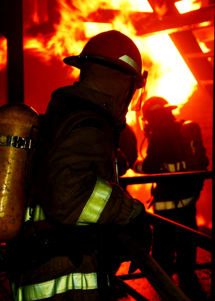 US Navy 100610-N-2218S-003 A Sailor assigned to the amphibious transport dock ship USS Denver (LPD 9) mans a hose at the Yokosuka Center for Naval Engineering Firefighting School
