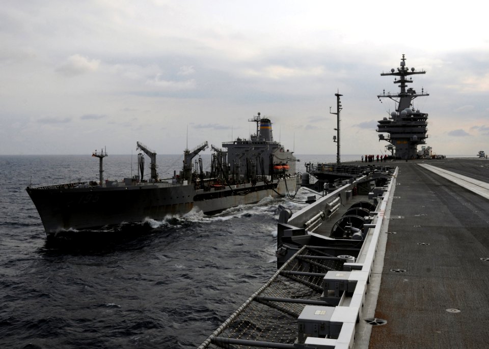 US Navy 100610-N-3885H-027 USNS Leroy Grumman (T-AO 195) cruises alongside USS George H.W. Bush (CVN 77) while transferring fuel during an underway replenishment