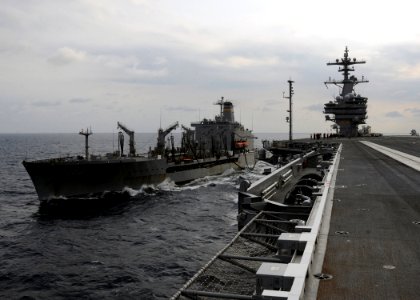 US Navy 100610-N-3885H-027 USNS Leroy Grumman (T-AO 195) cruises alongside USS George H.W. Bush (CVN 77) while transferring fuel during an underway replenishment