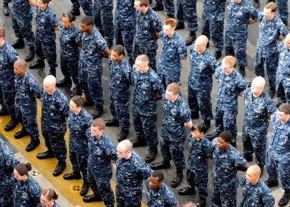 US Navy 100611-N-8936G-016 Newly-promoted petty officers stand in formation during a frocking ceremony aboard the amphibious assault ship USS Nassau (LHA 4)