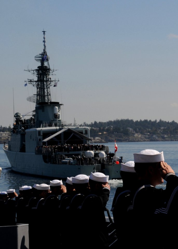 US Navy 100612-N-3327M-042 Sailors aboard the guided-missile cruiser USS Chosin (CG 65) render passing honors to the Canadian navy destroyer HMCS Algonquin (DDG 283)