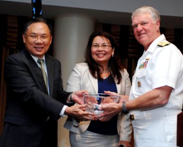 US Navy 100610-N-3548M-075 Chief of Naval Operations (CNO) Adm. Gary Roughead, right, is presented the Excellence in Public Service Leadership Award by representatives of the Asian American Government Executives Network