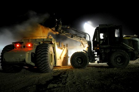 US Navy 100613-N-0475R-659 Equipment Operator 3rd Class Jeremy Ott, a Seabee assigned to Naval Mobile Construction Battalion (NMCB) 5, uses a loader to move fill at a project at Camp Leatherneck