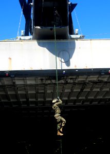 US Navy 100612-N-1226D-083 Lance Cpl. Jhonson Simeon fast ropes down a rope attached to a CH-46 Sea Knight Helicopter