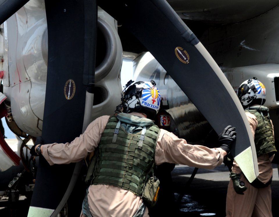 US Navy 100614-N-4236E-192 Aviators perform pre-flight checks an E-2C Hawkeye assigned to the Bluetails of Airborne Early Warning Squadron (VAW) 121 on the flight deck of aircraft carrier USS Dwight D. Eisenhower (CVN 69)