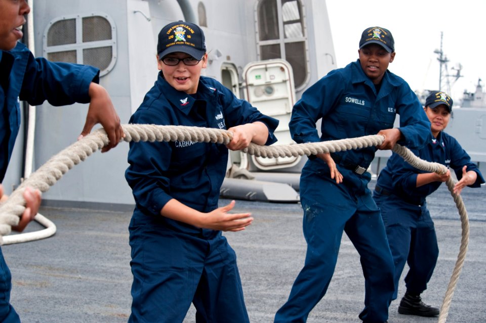 US Navy 100610-N-5319A-133 Seaman Tecara Gray, left, Boatswain's Mate 3rd Class Renee Cabrales, Boatswain's Mate Seaman Ashley Sowells and Boatswain's Mate 3rd Class Maraalysa Maneru heave aboard the forward lines aboard USS Ne