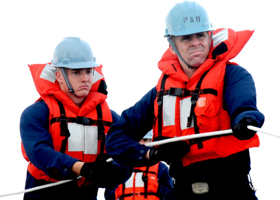 US Navy 100610-N-7908T-084 Boatswain's Mate Seaman Brandon M. Foor, left, and Boatswain's Mate Seaman Chuck L. Norris, of Deck Department