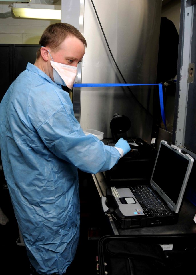US Navy 100610-N-8936G-062 Hospital Corpsman 1st Class Thomas Lorenc, from Merden, Conn., performs a joint biological agent identification diagnostic system (JBADS) simulation