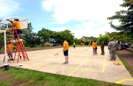 US Navy 100610-N-4971L-252 Sailors and Marines deployed aboard Swift (HSV 2) refurbish a basketball court during a community service project in Corinto, Nicaragua