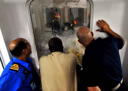 US Navy 100610-N-7643B-085 Senior leaders watch Sailors from the guided-missle frigate USS Vandegrift (FFG 48) as they train in the damage control wet trainer