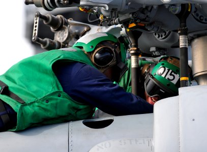 US Navy 100614-N-7948R-202 Aviation Structural Mechanic 3rd Class John Heering and Aviation Machinist's Mate 3rd Class Michael Upton
