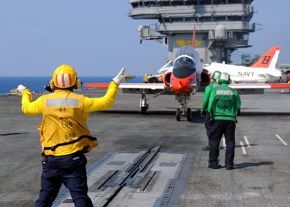 US Navy 100613-N-3885H-158 A Sailor directs a T-45A Goshawk as it prepares for launch from USS George H.W. Bush (CVN 77)