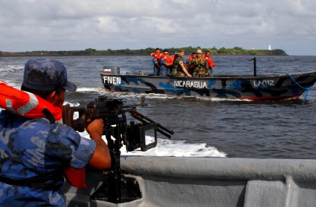 US Navy 100615-N-4971L-164 Sailors deployed aboard High Speed Vessel Swift (HSV 2) and members of the Nicaraguan navy conduct visit, board, search and seizure subject matter expert exchange operations photo