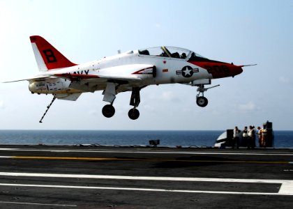 US Navy 100614-N-7908T-089 Landing signal officers watch a T-45A Goshawk training aircraft land aboard USS George H.W. Bush (CVN 77)