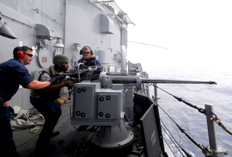 US Navy 100614-N-7638K-380 Chief Gunner's Mate Sean Holmes, from Houston, Texas, left, and Gunner's Mate 1st Class Bruce Smith