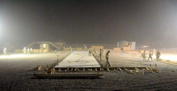 US Navy 100615-N-0475R-240 Seabees assigned to Naval Mobile Construction Battalion (NMCB) 5 build a concrete pad at Camp Leatherneck
