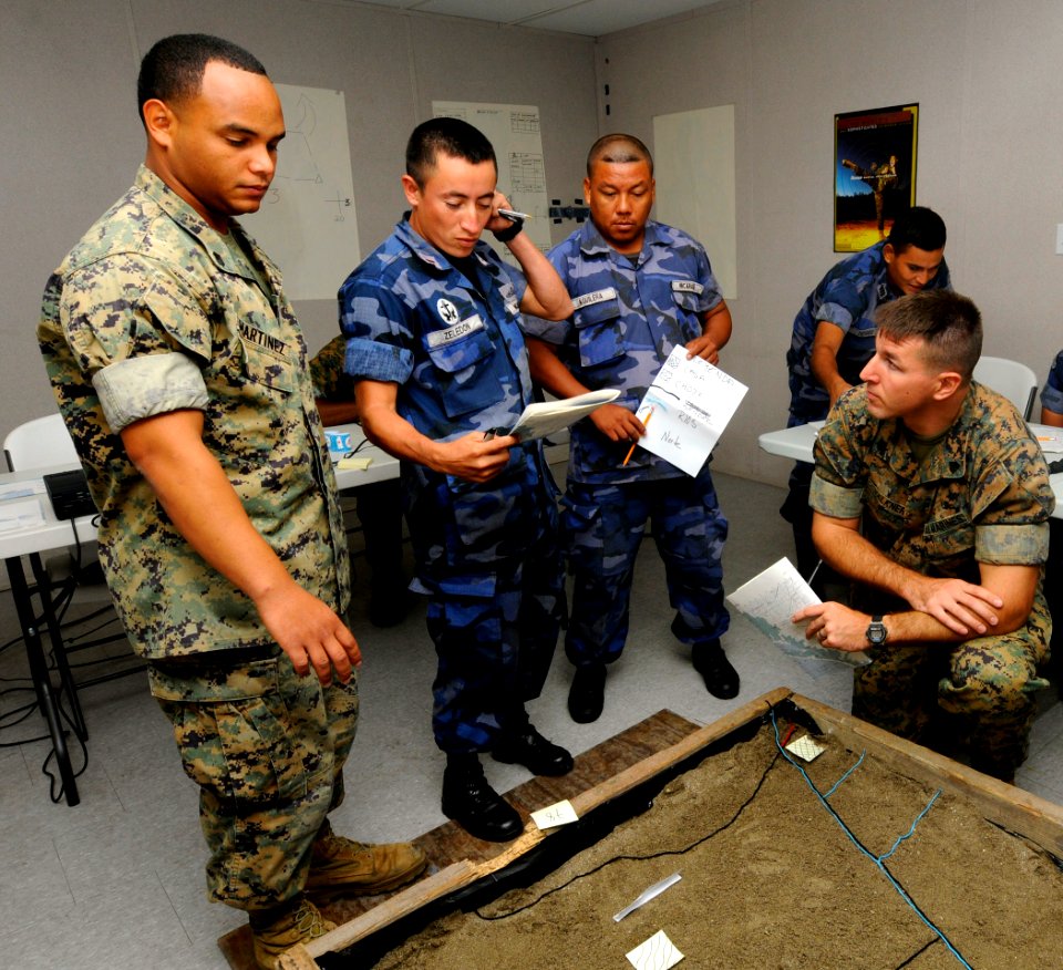 US Navy 100615-N-9643W-230 Sgts. Juan Martinez and Edan Valkner evaluate a 3D-model terrain with members of the Nicaraguan military during a subject matter expert exchange