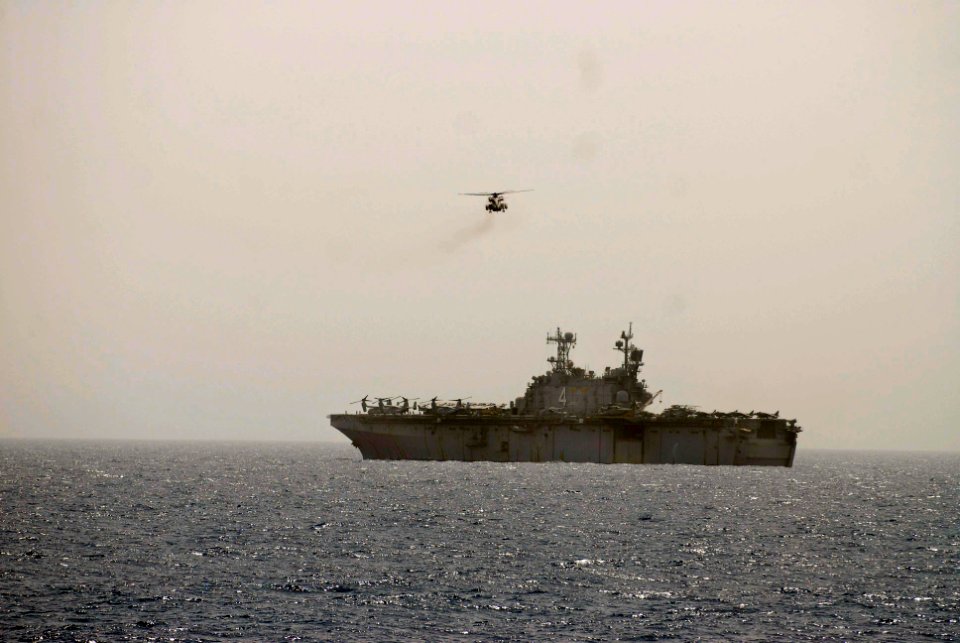 US Navy 100613-N-3358S-069 A CH-53E Super Stallion helicopter assigned to the Golden Eagles of Marine Medium Tiltrotor Squadron (VMM) 162 (Reinforced) returns to the amphibious assault ship USS Nassau (LHA 4)