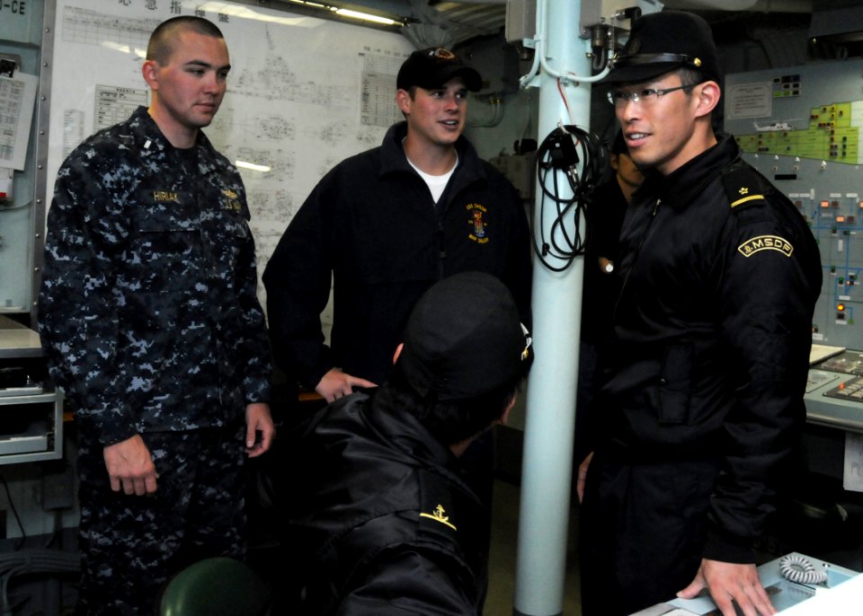 US Navy 100616-N-3327M-003 Lt. j.g. Chris Hiriak and Lt. j.g. Carter Stapleton, visit the damage control center of the Japan Maritime self-Defense Force guided-missile destroyer JDS Atago (DDG 177)