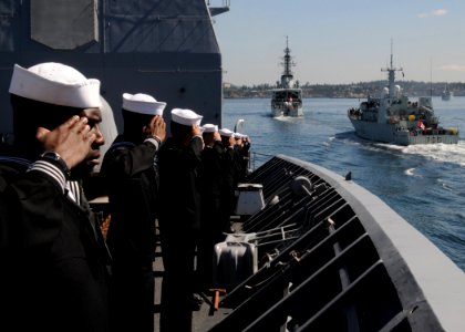 US Navy 100612-N-3327M-048 Sailors aboard the guided-missile cruiser USS Chosin (CG 65) render passing honors to the Canadian navy destroyer HMCS Algonquin (DDG 283)
