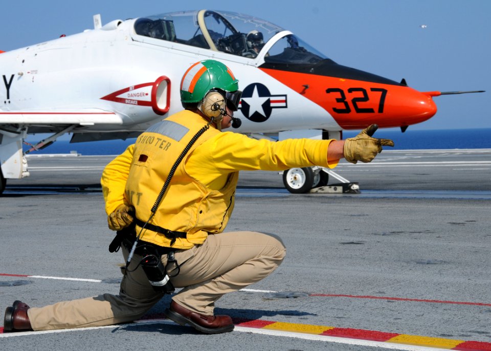 US Navy 100613-N-6509M-354 A shooter launches a T-45A Goshawk from USS George H.W. Bush (CVN 77)