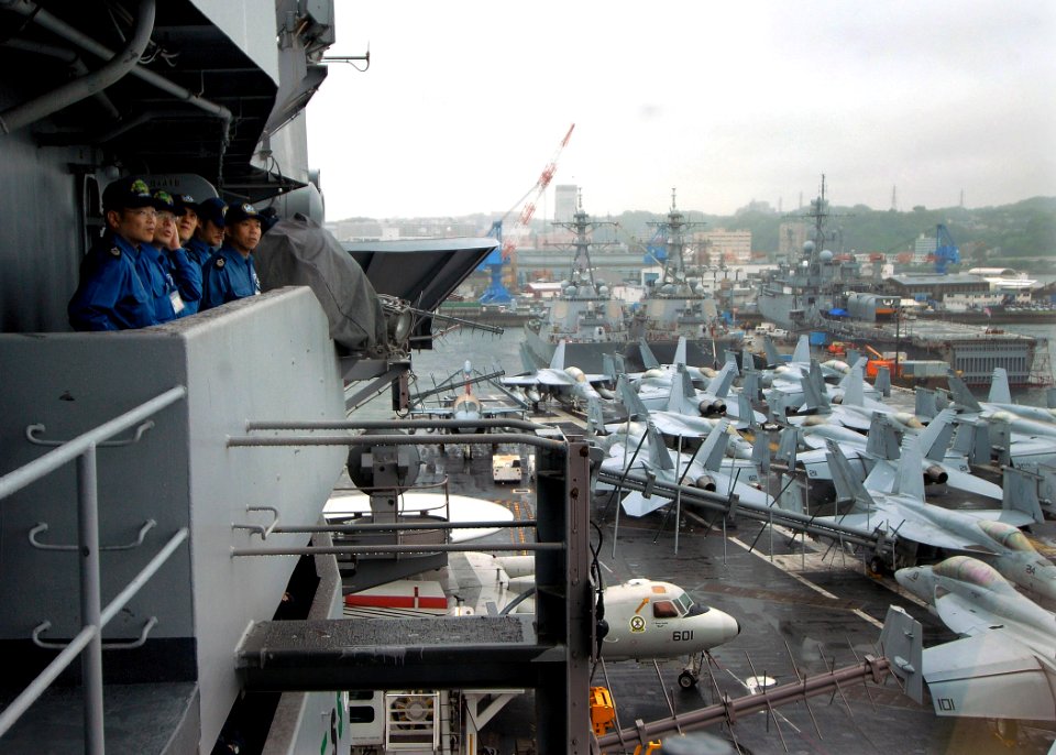 US Navy 100614-N-2013O-001 Sailors from the Japan Maritime Self-Defense Force observe the flight deck aboard the aircraft carrier USS George Washington (CVN 73) during sea and anchor detail
