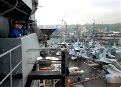 US Navy 100614-N-2013O-001 Sailors from the Japan Maritime Self-Defense Force observe the flight deck aboard the aircraft carrier USS George Washington (CVN 73) during sea and anchor detail