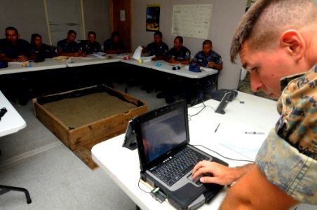 US Navy 100615-N-9643W-016 Sgt. Edan Valkner prepares a presentation for Marines deployed aboard High Speed Vessel Swift (HSV 2) and members of the Nicaraguan military during a terrain model subject matter expert exchange photo