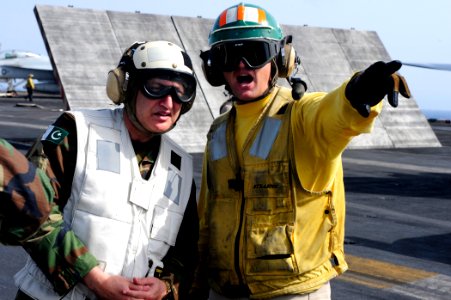 US Navy 100614-N-6604E-119 Lt. Christopher Dirkschneider explains aircraft carrier flight operations to Pakistani navy Rear Adm. Zafar Mahmood Abbasi
